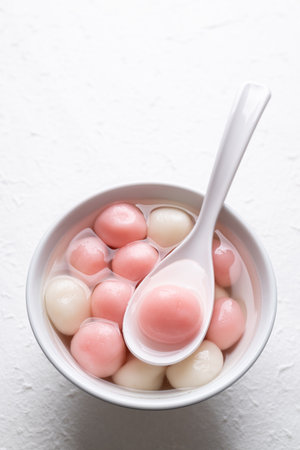 Tangyuan (Chinese sweet dumpling), Glutinous rice ball in syrup, Dessert celebrated in mid autumn lantern festival or new yearの写真素材