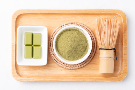 Matcha powder and chocolate on white backgroundの写真素材