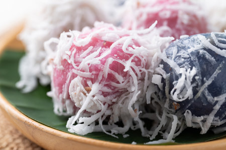 Thai coconut ball (Khanom Tom), Traditional Thai dessert made from boiled glutinous rice flour stuffed with sweet coconut and coated with shredded coconutの写真素材