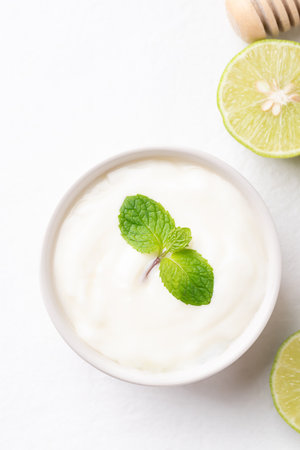 Yogurt and lime on white backgroundの写真素材