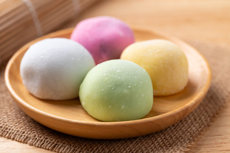 Daifuku mochi (Traditional Japanese sweet) on wooden plateの写真素材
