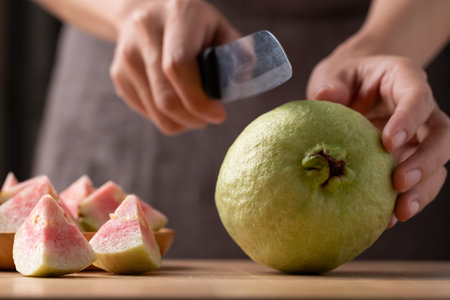 Red guava cutting on wooden board, Tropical fruit high vitamin Cの写真素材