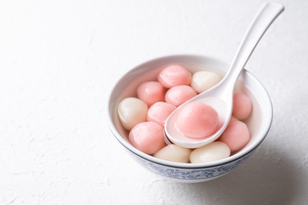 Tangyuan (Chinese sweet dumpling), Glutinous rice ball in syrup, Dessert celebrated in mid autumn lantern festival or new yearの写真素材