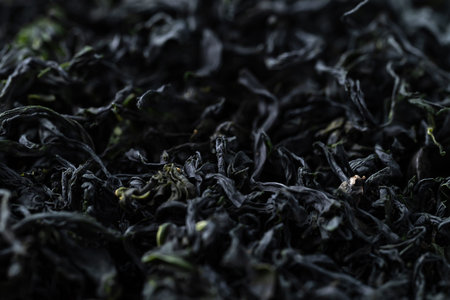 Close up of dried Wakame seaweed texture background, Organic Asian food ingredientの写真素材