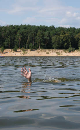 The man is drowning in water. Place for text.の写真素材