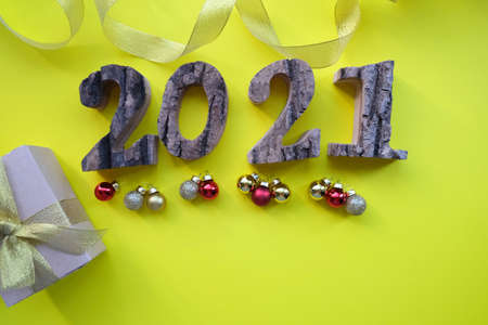 Christmas card, for New Year's greetings 2021 on a yellow background.の写真素材