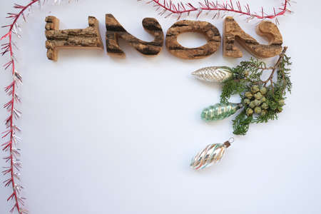 On a white background, a Christmas tree branch with toys. Christmas background.の写真素材