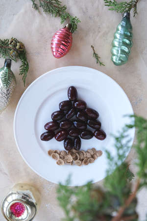 Funny New Year's dessert of 2021 dogwood berries. Breakfast idea for children. Vegetarian new year. New Year, Christmas food, top view. holiday, holiday, culinary arts.の写真素材