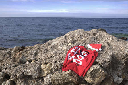 Laundry of Santa Claus. A New Years sweater is drying on the beach. High quality photo