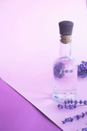 Natural aromatic lavender water - hydrolat and a bouquet of lavender flowers. High quality photoの写真素材