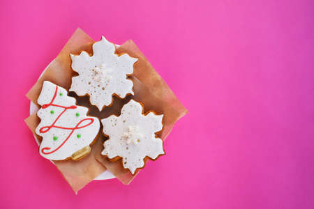On a pink background, New Years gingerbread, orange, cinnamon.Composition with empty space for text.Top view, flat lay.の写真素材