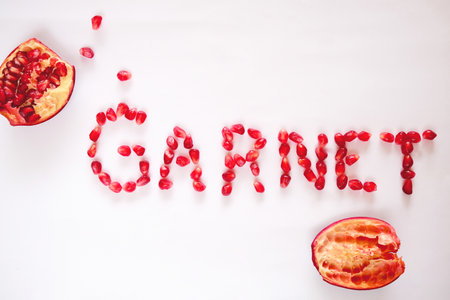Creative layout made of pomegranate. Flat lay. Food concept. Macro concept. High quality photoの写真素材