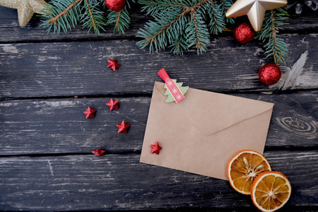 On a wooden table there is an envelope and a New Years composition. Letter to Santa Claus.の写真素材
