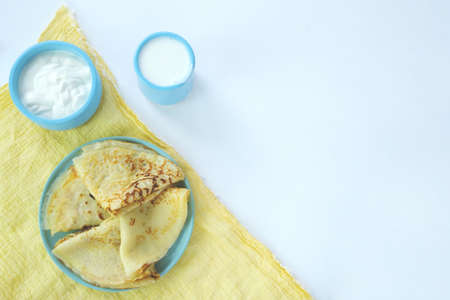 Maslenitsa week. Shrovetide Maslenitsa festival meal. Russian pancakes with fresh cream cheese. Country styleの写真素材