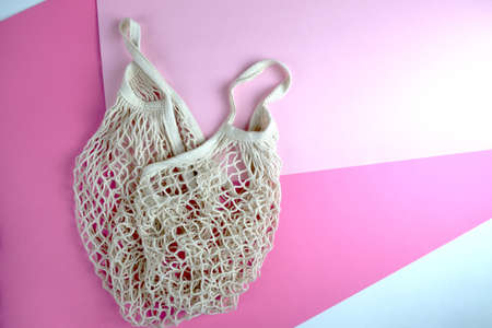 Empty shopping bag on a colored background. There is no plastic in the concept. Choose an...