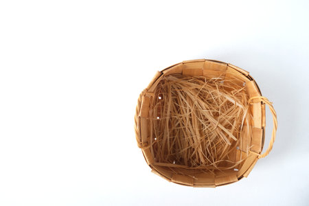 Wicker basket on a white background. Place for your text.