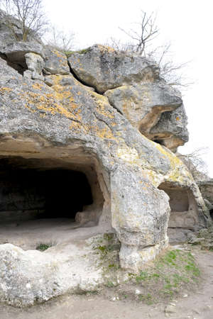 Spring or autumn landscape with the cave town of Chufut-Kale. Ancient city in white rocks. Crimea, Balaklava.の写真素材