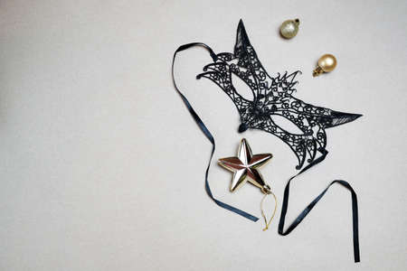 New Years black carnival mask. Festive Christmas outing. Symbol of 2022 on the Eastern calendar. Holidays concept, theme party.の写真素材