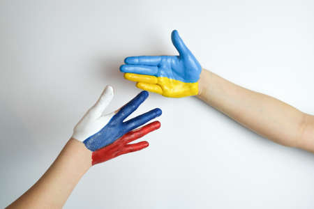 Hand painted in the colors of the flag of Russia and Ukraine. War in Ukraine. High quality photoの写真素材