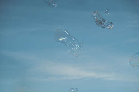 Blowing large soap bubbles in the air. Vintage freedom, summer concepts.の写真素材