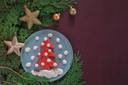 Creative christmas mockup funny edible tree, christmas breakfast idea for kids from watermelon. Flat lay. Food concept. Christmas and New Year 2023 food background.の写真素材