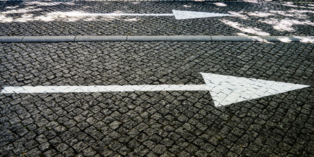 Direction arrows on the streetの写真素材