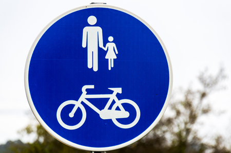 Blue walkway sign for people and byciclesの写真素材