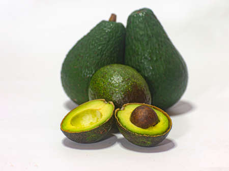 Close-up fresh avocado on white background. Fruit of health benefits.