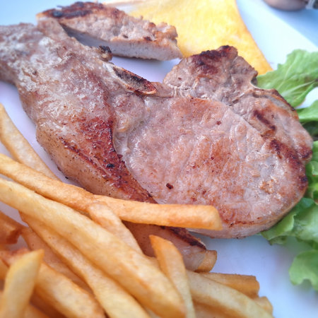 Pork chop steak with French Friesの写真素材