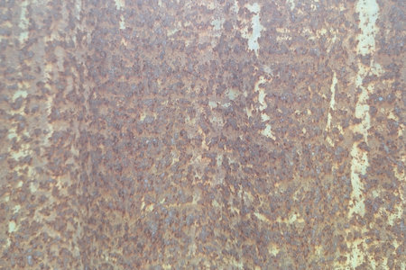 Rusty textured metal surface with abstract corrosion pattern and grunge background
