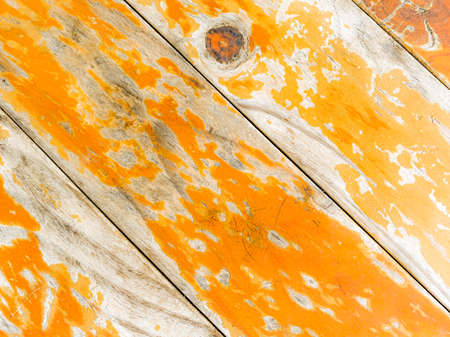Orange flaky background color and wooden texture. Orange background.の写真素材