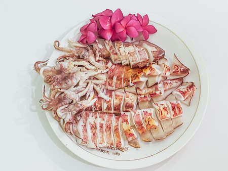 grilled squid on a plate It is a delicious Thai food that is popular in the Red Sea region.