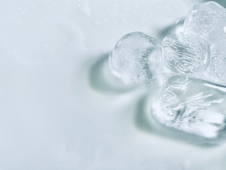 Ice cubes background, ice cube texture or background It makes me feel fresh and feel good, In the summer, ice and cold drinks will make us feel relaxedの写真素材