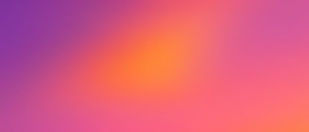 A smooth gradient blending pink, purple, orange, and yellow hues, creating a vibrant and warm abstract background.の写真素材