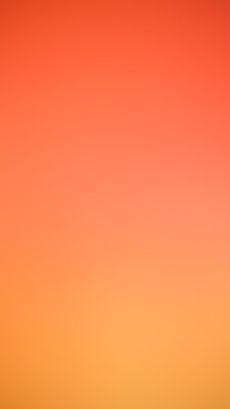 Light orange dark blurred bright background,abstract vibrant orange dark  blurry color background...