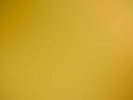Light orange dark blurred bright background, abstract vibrant orange dark blurry color background...