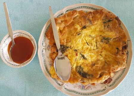 Omelette with vegetables served with chili sauceà¹の写真素材