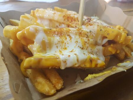 Yellow French Topped with Cheeseの写真素材