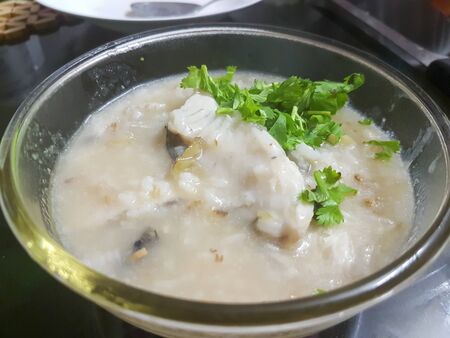 Porridge with sea bass fishの写真素材