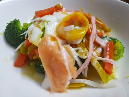 homemade salad with soft-boiled egg.の写真素材