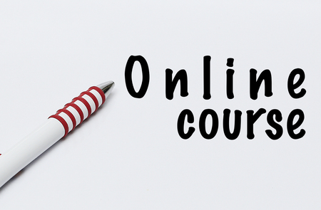 pen writes online course on white blank paperの写真素材