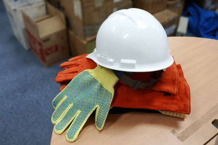 A white safety helmet to protect workers' heads from work accidents, such as collisions with hard...