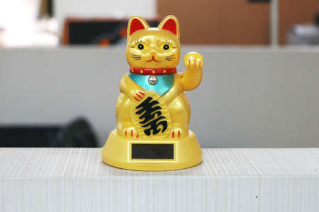 These decorations are called maneki neko or often referred to as fortune cats. Maneki neko himself must always be in business places.This little cat statue is very popular in Japanの写真素材