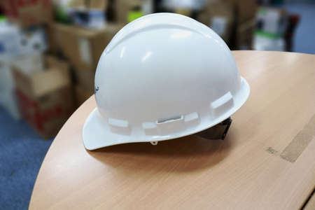 A white safety helmet to protect workers' heads from work accidents, such as collisions with hard objects, helmets are a requirement of safety firstの写真素材