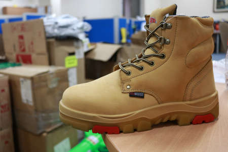 Mocca colored leather shoes for mountaineers, workers, students, motorcyclists. These safety shoes are to protect their feet from the impact of hard objectsの写真素材