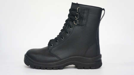 Men's black leather boot on a white background. Side view.の写真素材