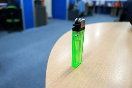 Green lighter on the table in the meeting room. Close-up.の写真素材