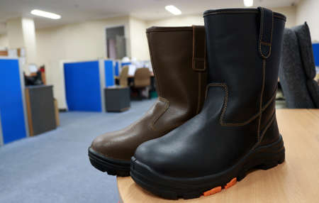 Men's black winter boots on the table. High quality photo