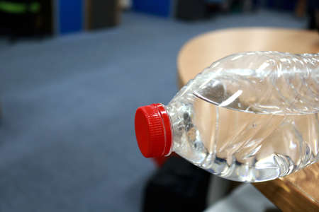 Bottle of water on table in gym, closeup. Space for textの写真素材