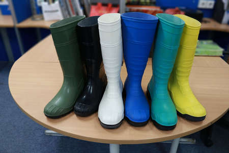 Rubber boots on a table, close-upの写真素材